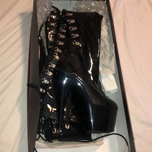 Thigh high black patent leather zip up boots